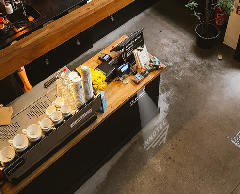 Logo Projection on coffee shop floor